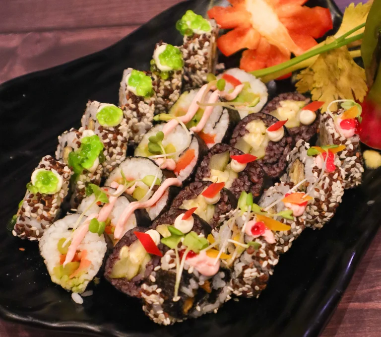 Assorted sushi platter with vegetable rolls, sesame-coated sushi with an Sar V Sri Fresh Catering Ideas