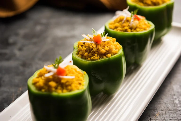Gourmet Indian wedding appetizer by Sar V Sri Catering featuring green capsicums stuffed with a spiced lentil