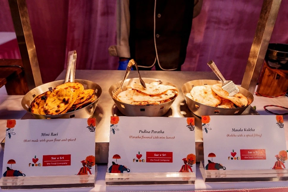 Sarvsri catering display in Chennai featuring a variety of Indian breads including Missi Roti, Pudina Paratha, and Masala Kulcha