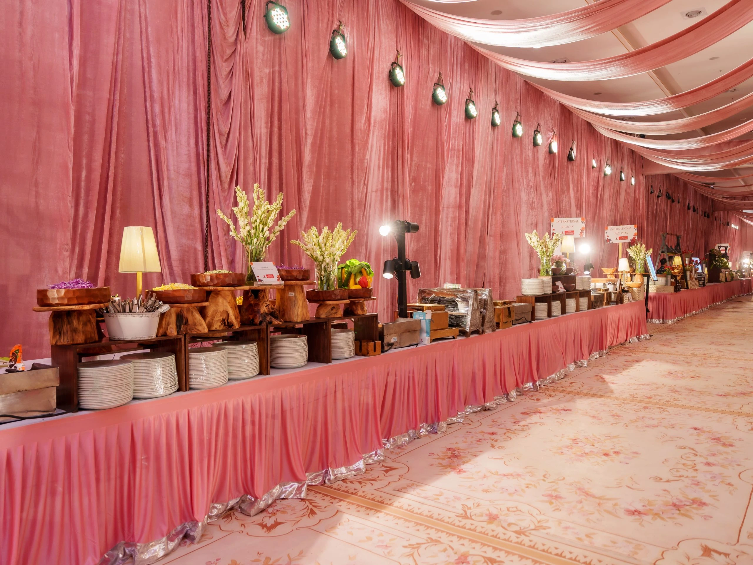 Elegant vegetarian buffet and sweet counter setup by for wedding and event celebrations.