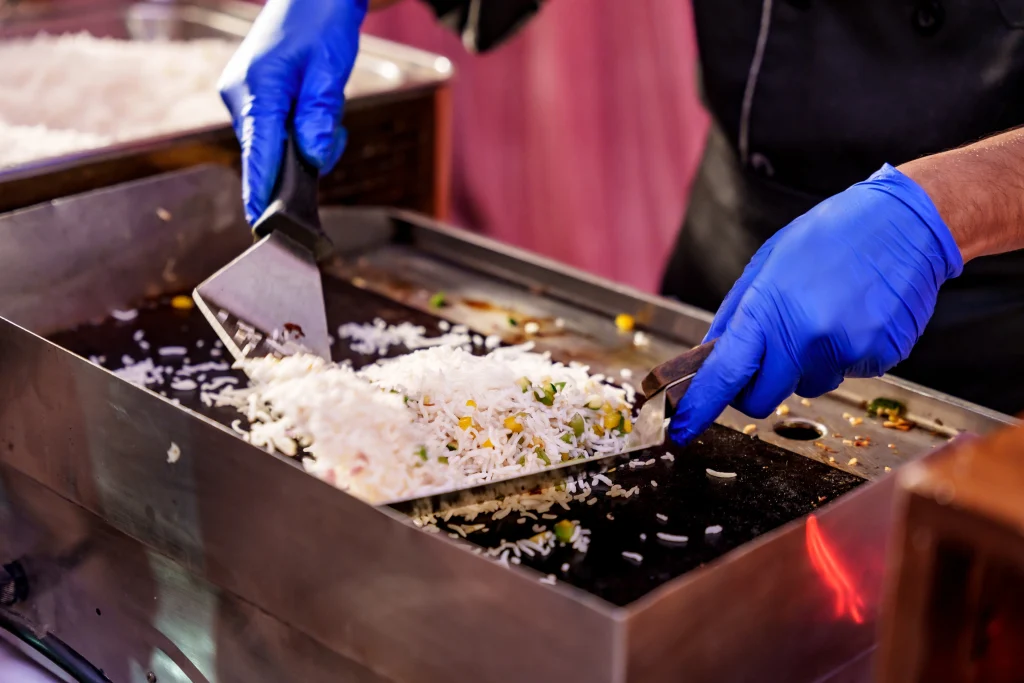 Chinese fried rice prepared live on flat grill