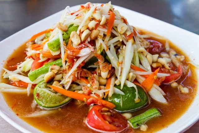 Thai green papaya salad with vegetables and peanuts served by Sar V Sri Thai Catering Services
